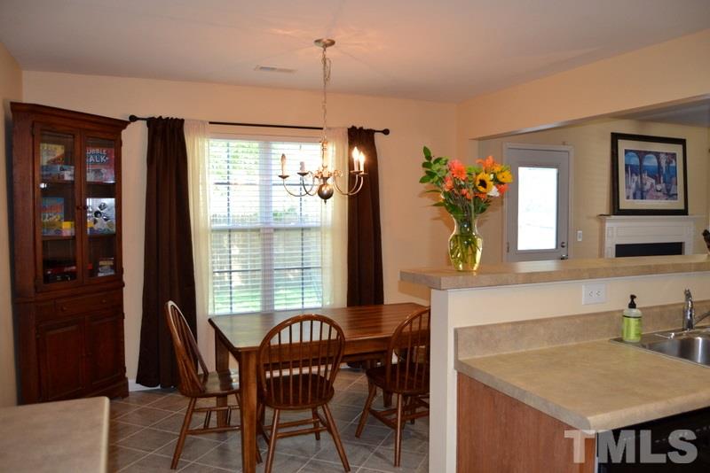 4235 Dalcross Road Raleigh, NC 27610 - Photo 10 of 25 a view of a dining room with furniture and window