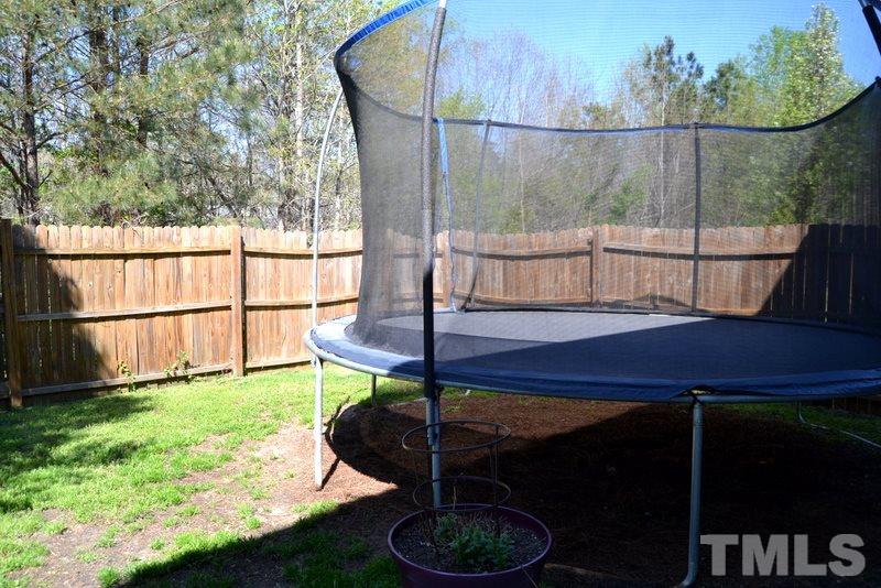 4235 Dalcross Road Raleigh, NC 27610 - Photo 23 of 25 a balcony with table and chairs
