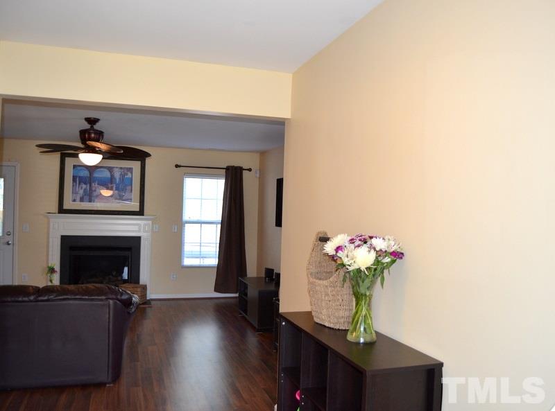 4235 Dalcross Road Raleigh, NC 27610 - Photo 6 of 25 a living room with furniture fireplace and flower pot