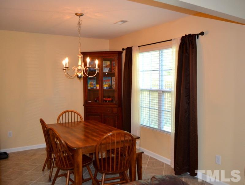 4235 Dalcross Road Raleigh, NC 27610 - Photo 8 of 25 a view of a dining room with furniture and window