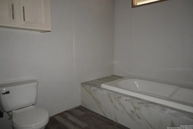 a bathroom with a sink and toilet