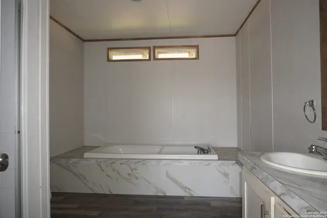 a bathroom with a sink and vanity