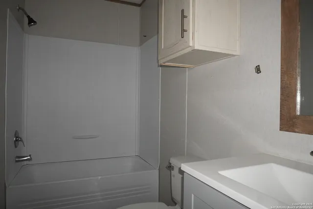 a bathroom with a bathtub and shower