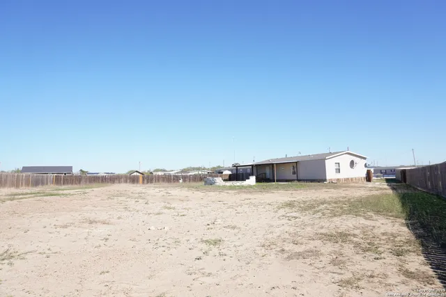 a view of ocean with large building