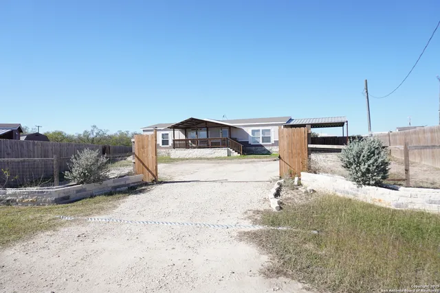 a house view with a backyard space