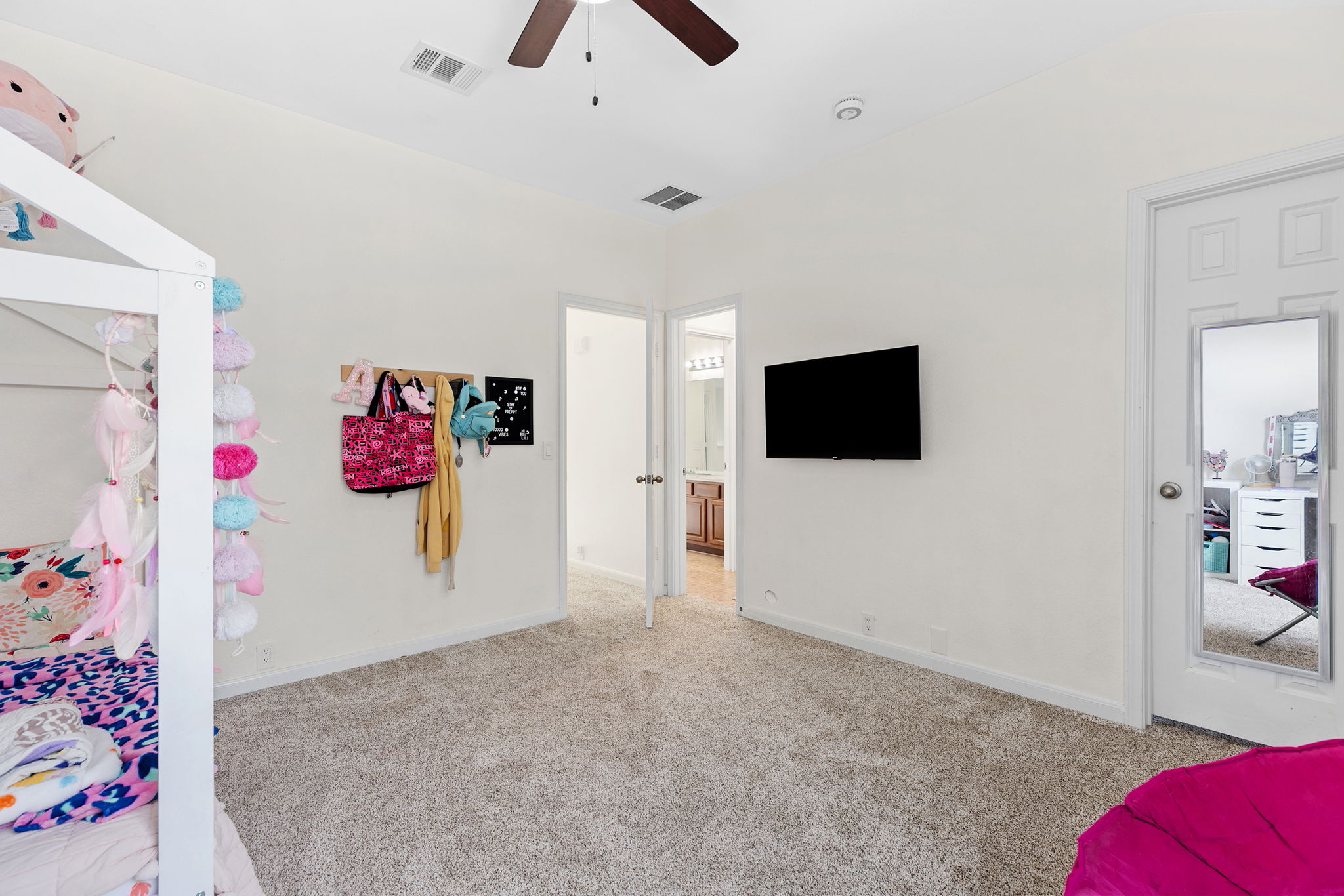 3517 Shiraz Loop Round Rock, TX 78665 - Photo 29 of 40 Carpeted room featuring a ceiling fan, recessed lighting, and a wall-mounted display