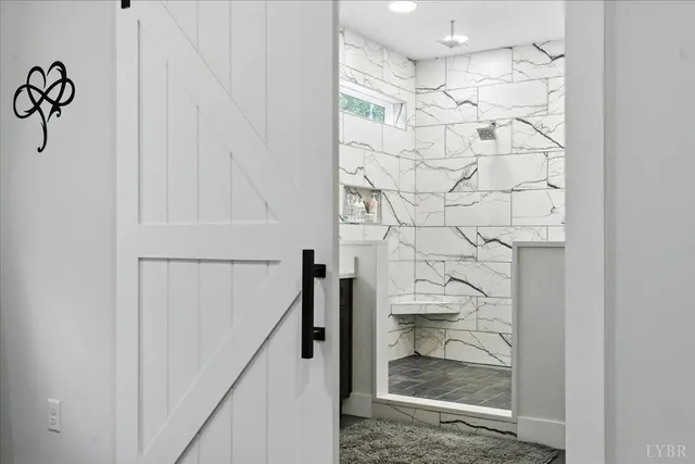 a bathroom with a sink a toilet and a shower