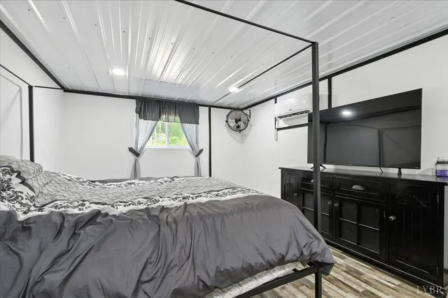 a living room with stainless steel appliances kitchen island granite countertop furniture and a view of kitchen