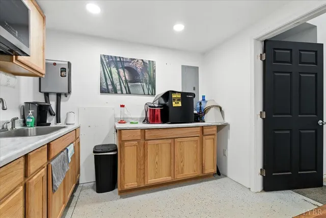 a kitchen with stainless steel appliances a sink a stove and a refrigerator