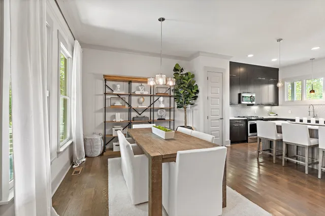 a kitchen with kitchen island granite countertop lots of counter top space and dining table