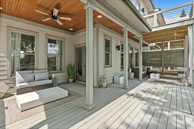 a balcony with couch and wooden floor