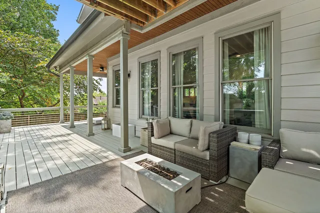 a outdoor space with patio the couches and a dining table with the view of the house