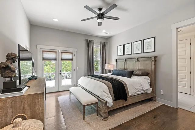 a bedroom with a bed couch and a window