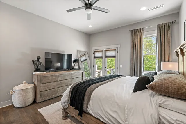 a bedroom with a bed and a television