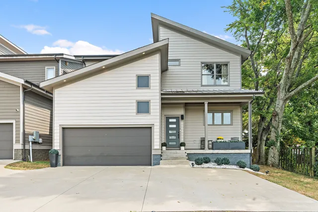 a front view of a house with yard