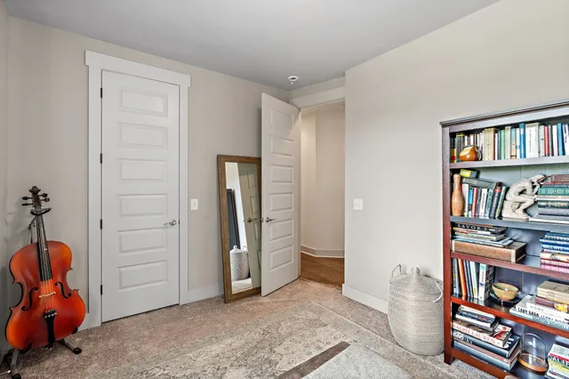 a view of a house with a yard and wooden fence