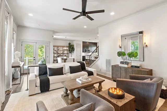 a living room with furniture and a table