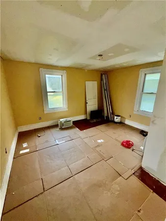 a view of an empty room with a window