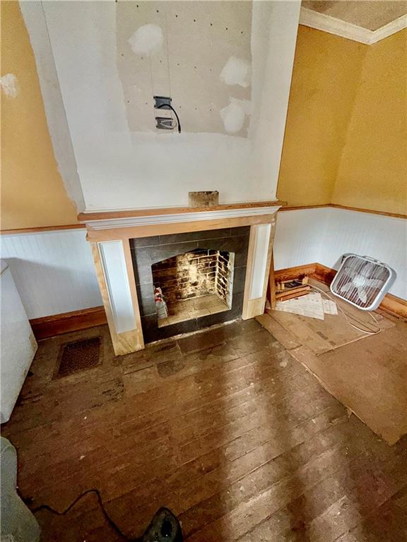 1594 Johnston Avenue Kittanning, PA 16201 - Photo 5 of 14 a view of an empty room with wooden floor and a fireplace