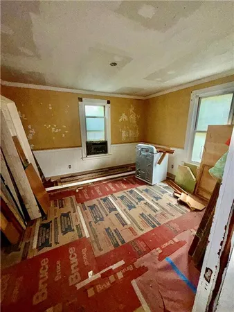 a living room with a bed and furniture