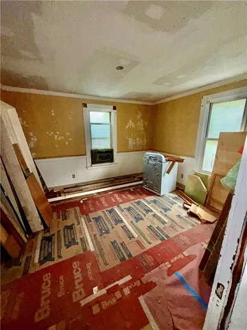 a living room with a bed and furniture