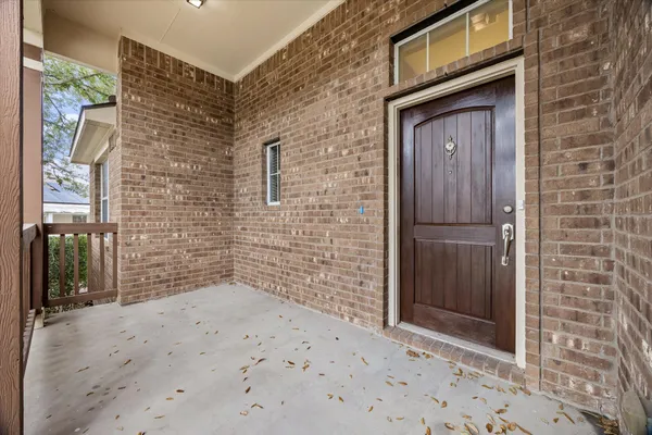 a view of an empty room with a kitchen