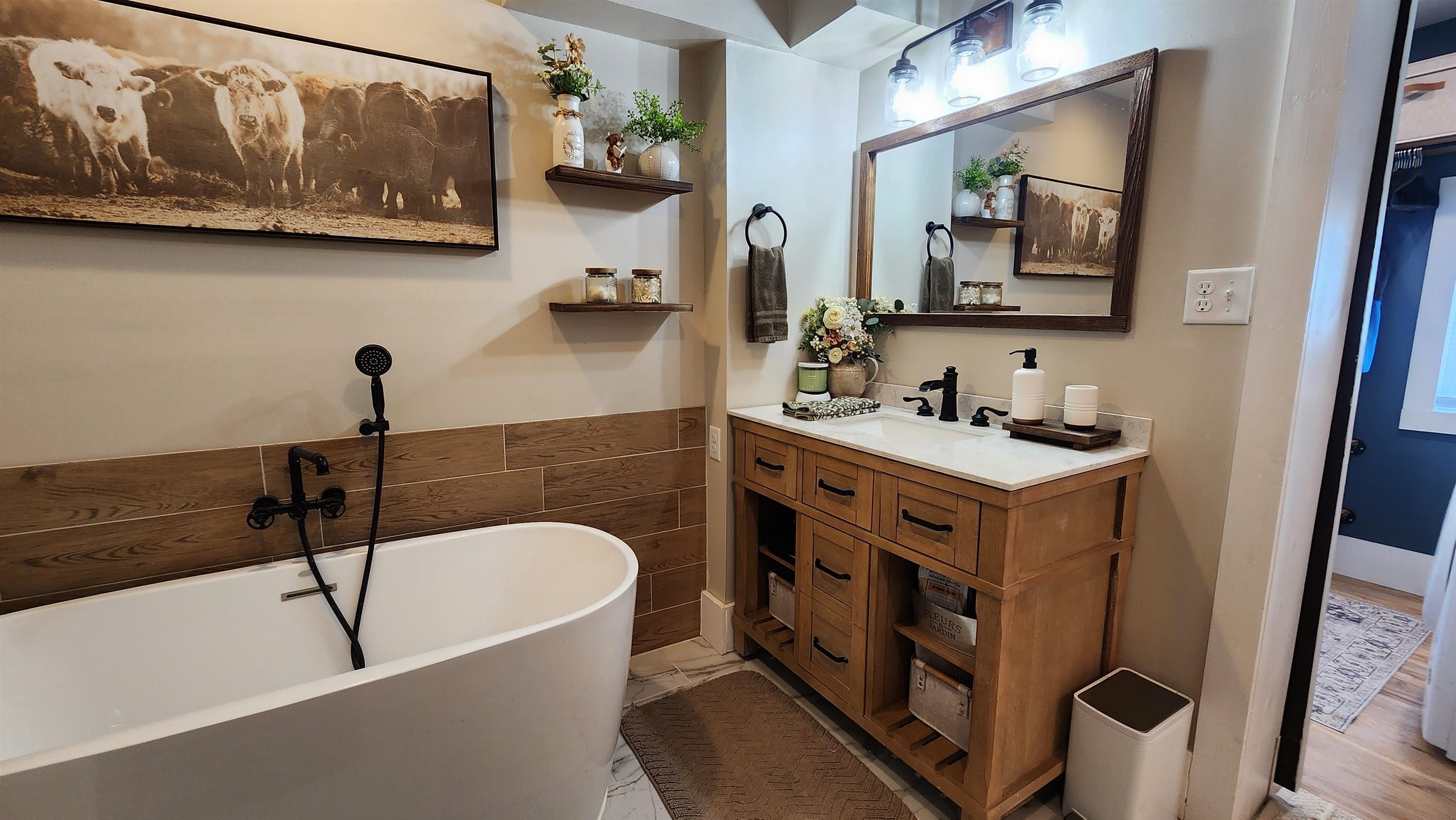 8999 Centerville Road Capron, IL 61012 - Photo 25 of 69 a bathroom with a bathtub sink and mirror