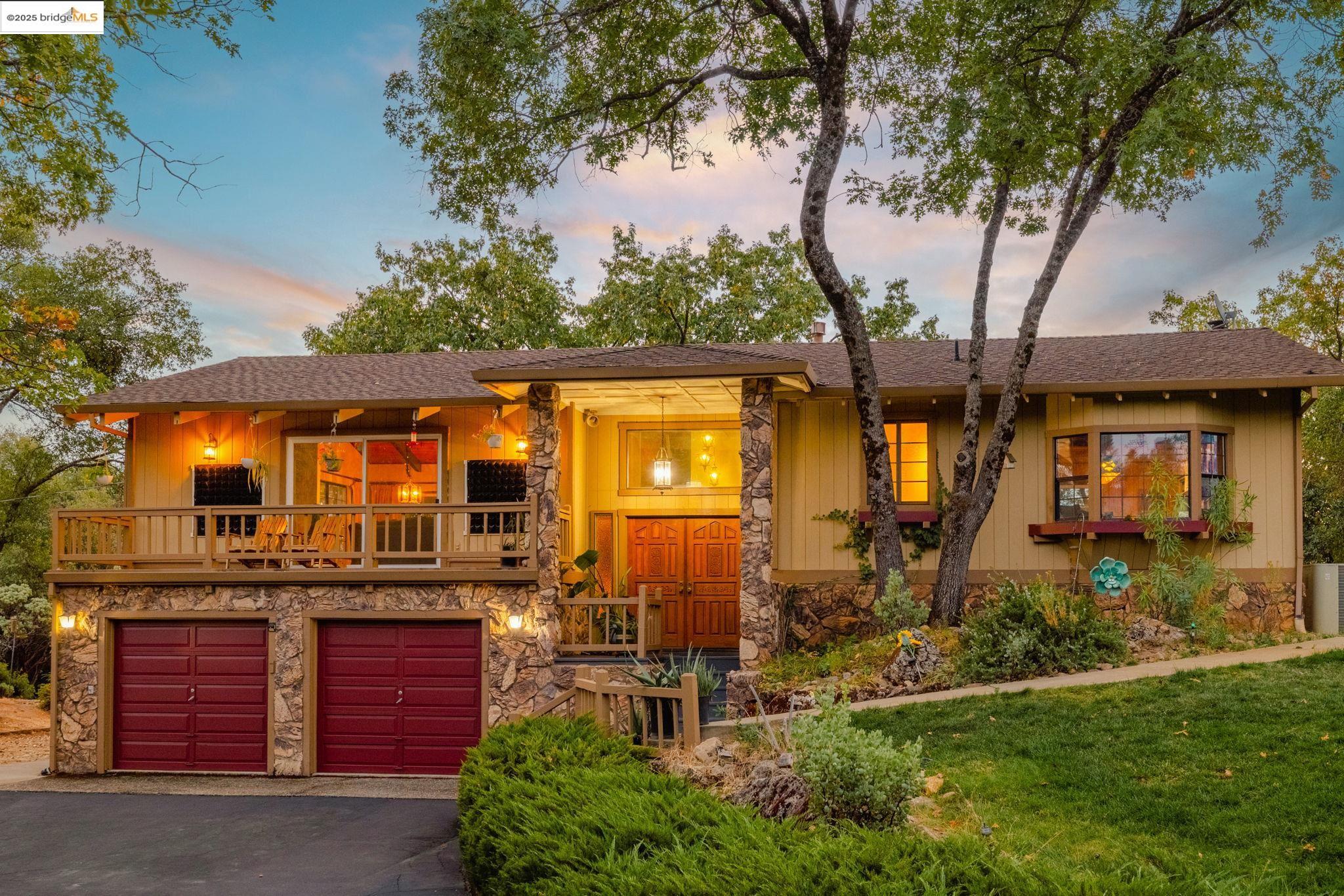 21950 Paseo De Los Portales Road Sonora, CA 95370 - Photo 1 of 47 front view of a house with a yard