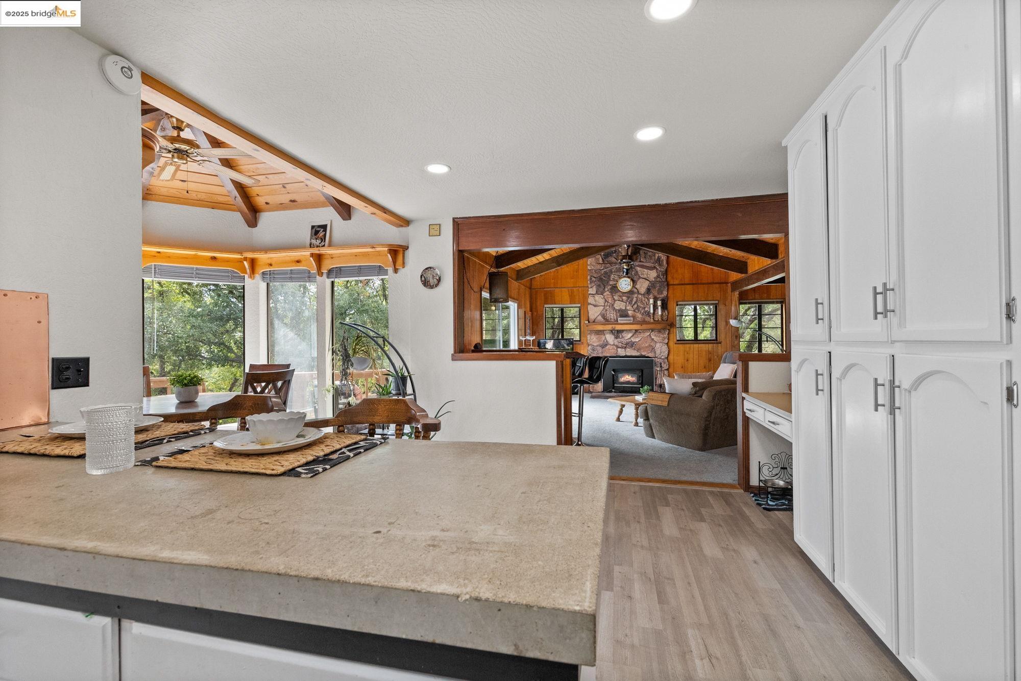 21950 Paseo De Los Portales Road Sonora, CA 95370 - Photo 16 of 47 a living room with furniture and large windows