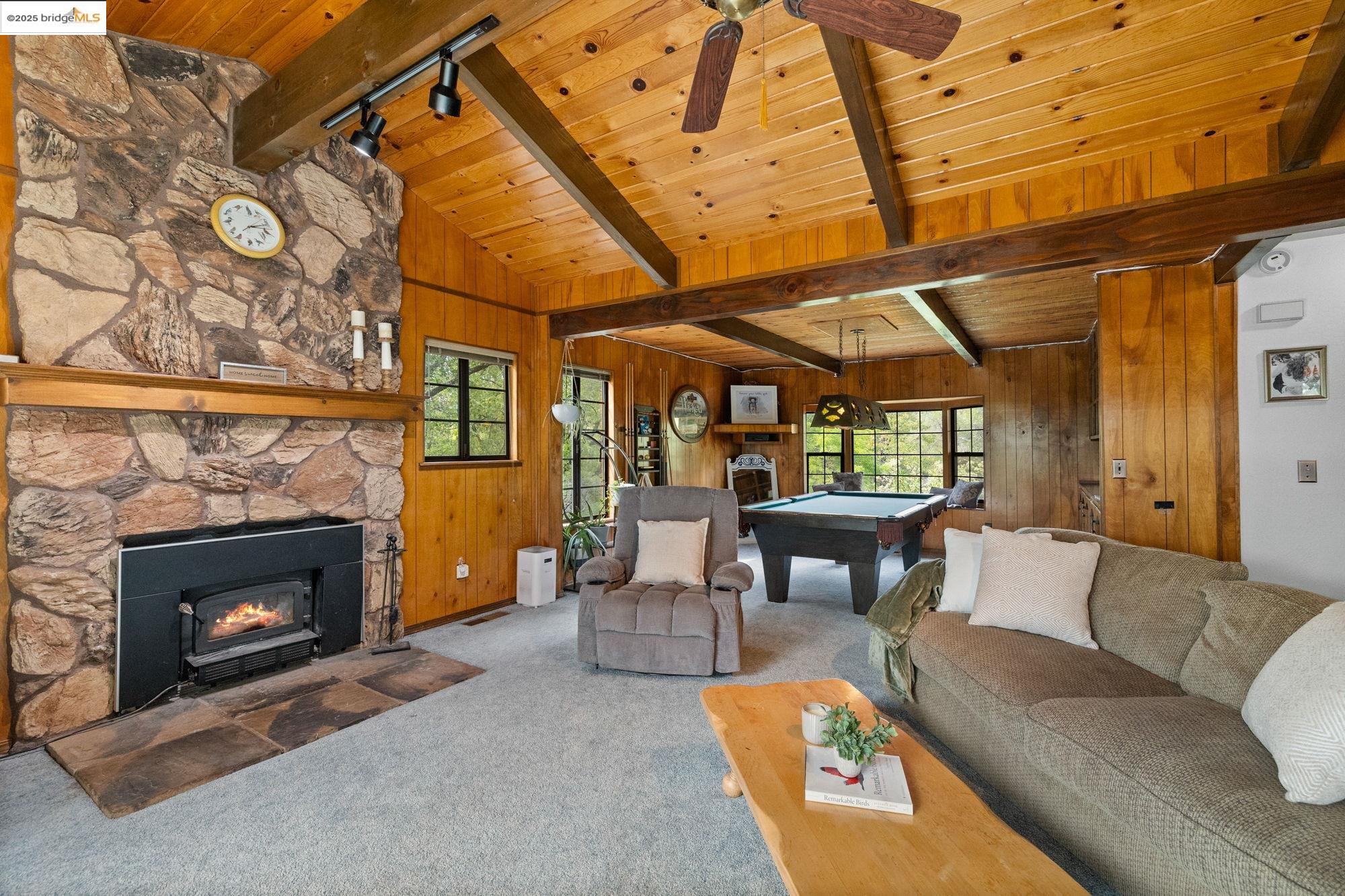 21950 Paseo De Los Portales Road Sonora, CA 95370 - Photo 19 of 47 a living room with furniture and a fireplace