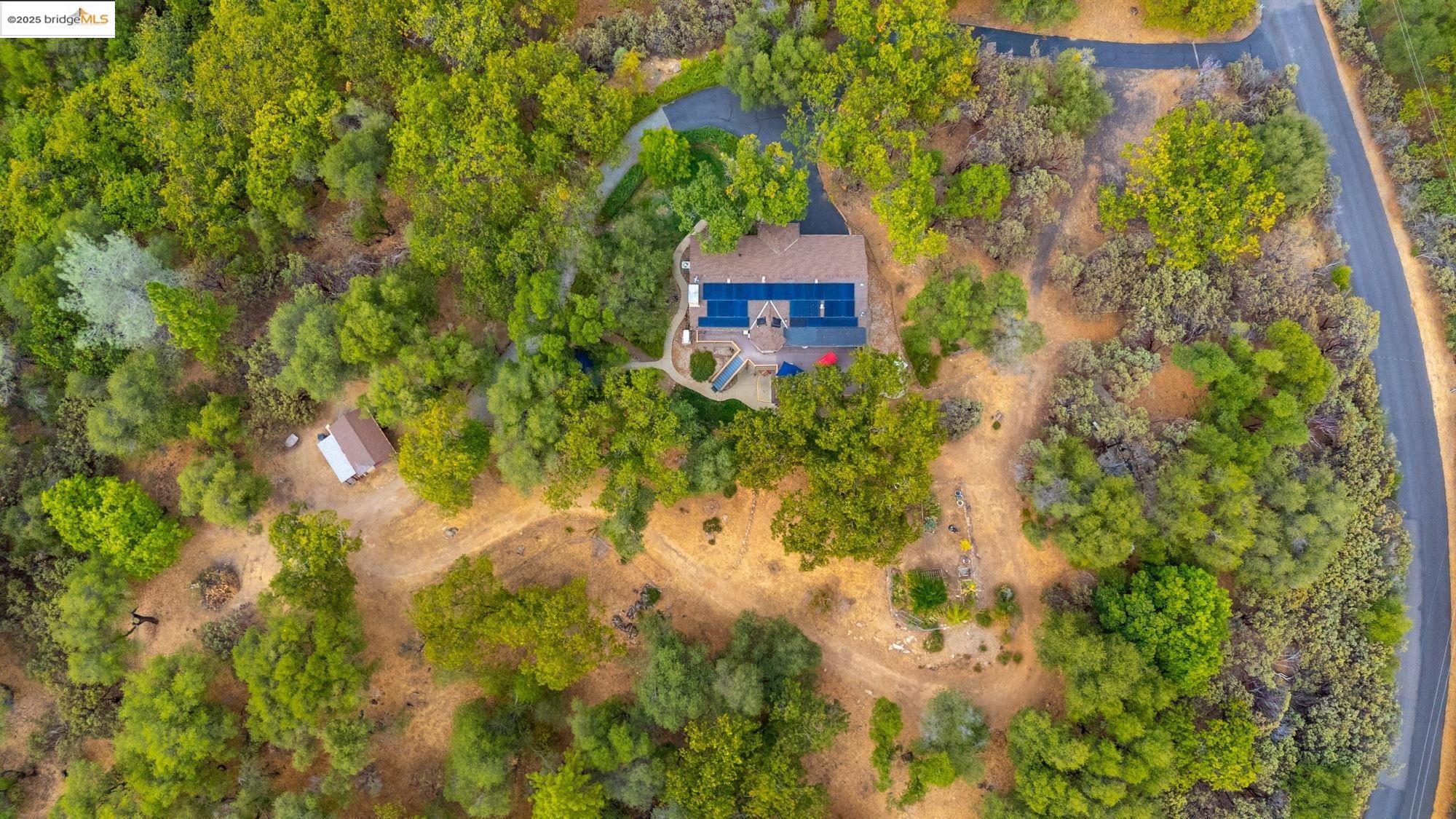 21950 Paseo De Los Portales Road Sonora, CA 95370 - Photo 2 of 47 a view of a house with a yard