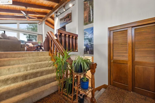 a view of entryway with a table and chairs