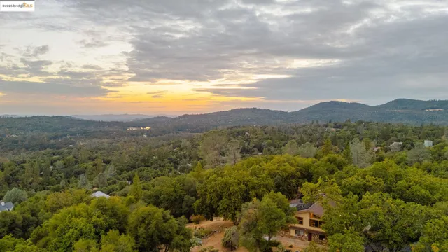 a view of a town with mountains in the background