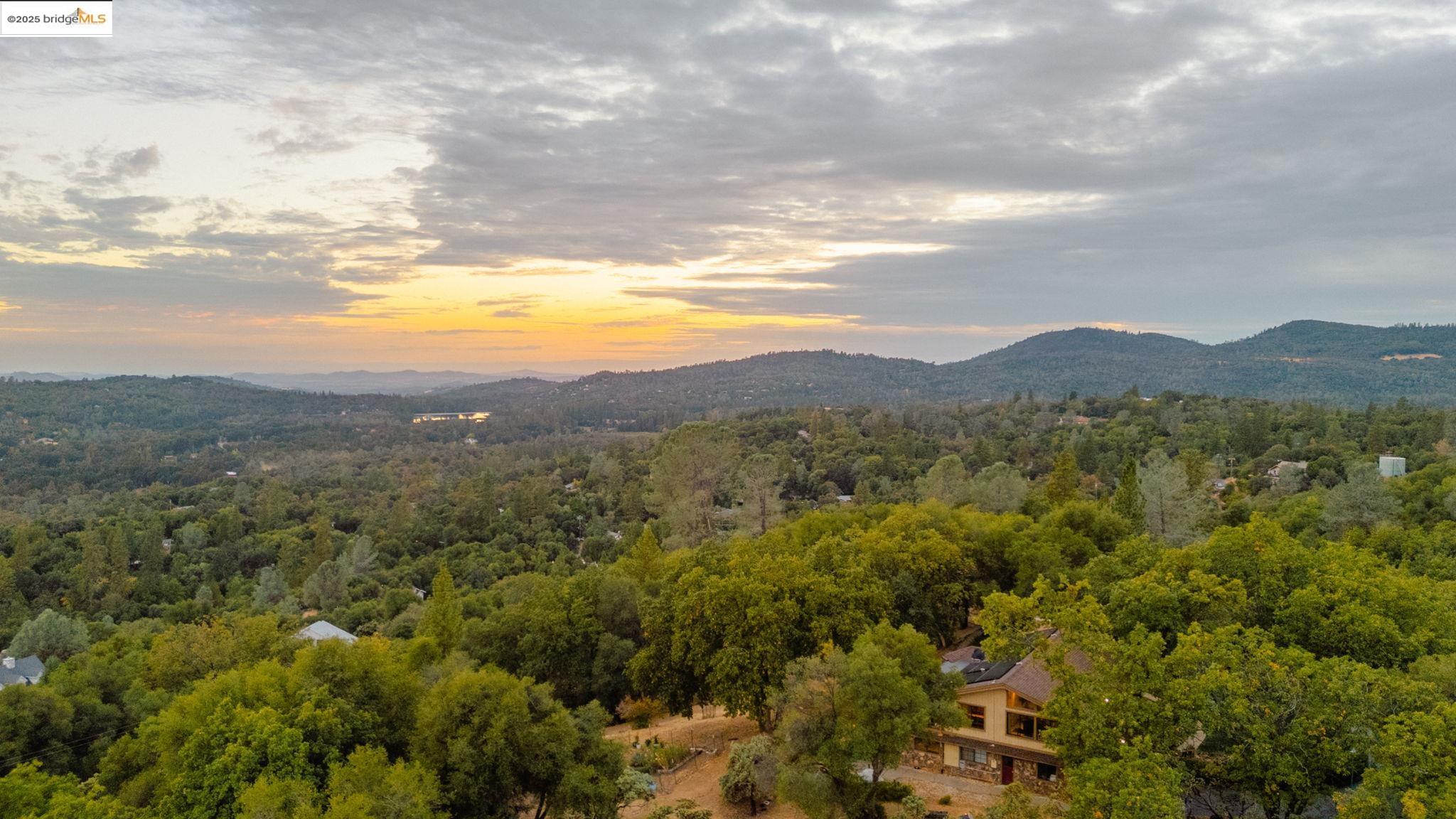 21950 Paseo De Los Portales Road Sonora, CA 95370 - Photo 3 of 47 a view of a town with mountains in the background