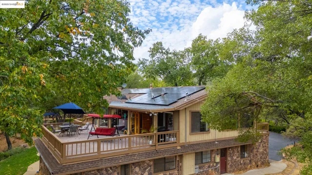 a view of a house with roof deck front of house