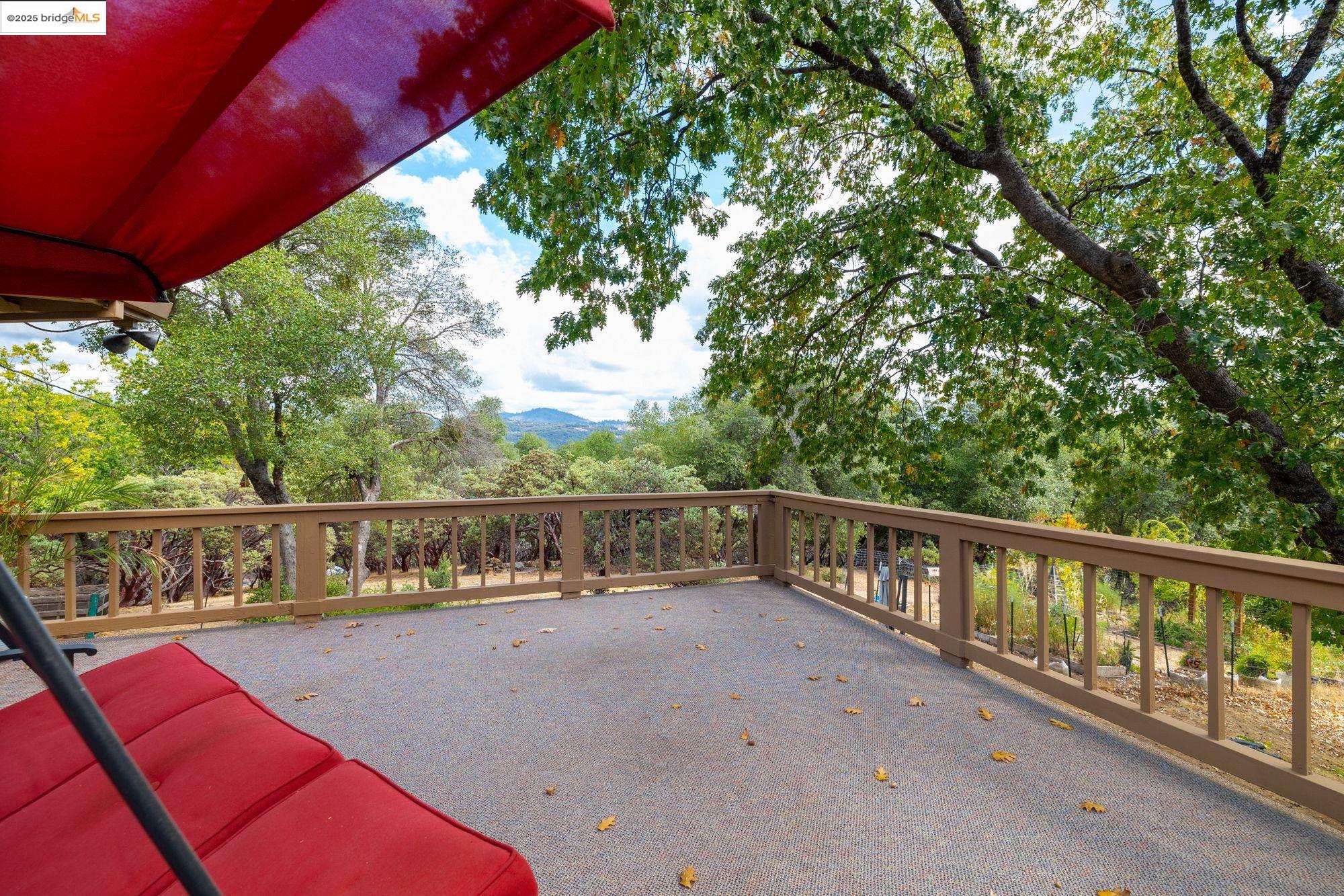 21950 Paseo De Los Portales Road Sonora, CA 95370 - Photo 38 of 47 a view of balcony with two large trees