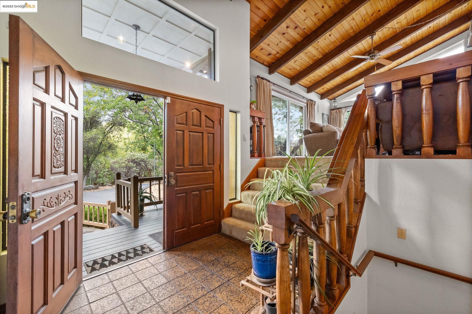 21950 Paseo De Los Portales Road Sonora, CA 95370 - Photo 4 of 47 a view of an entryway with wooden floor and outdoor seating