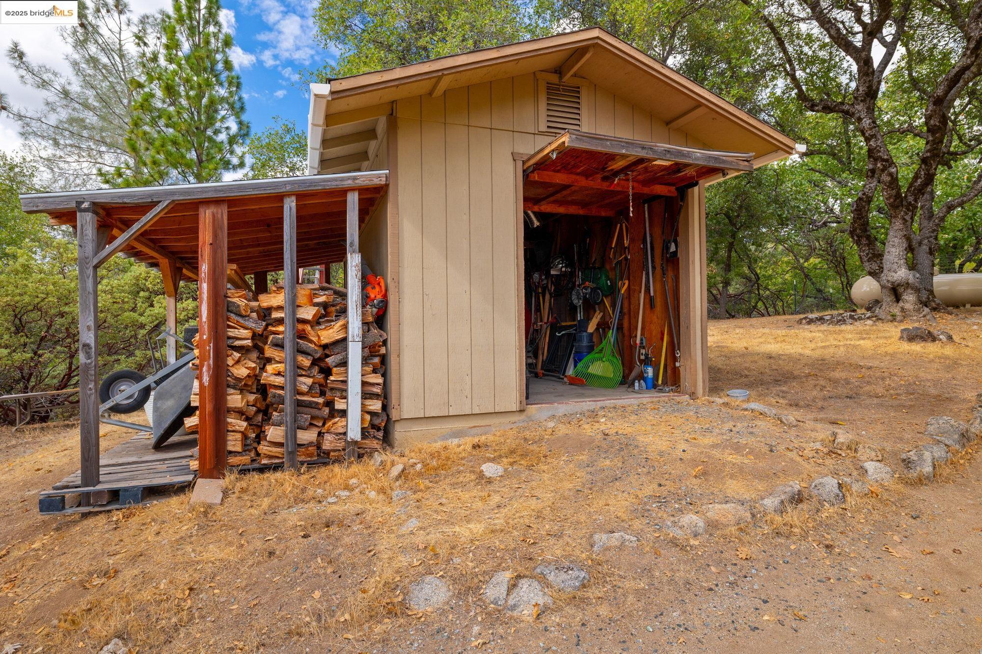 21950 Paseo De Los Portales Road Sonora, CA 95370 - Photo 42 of 47 a front view of a house with garden