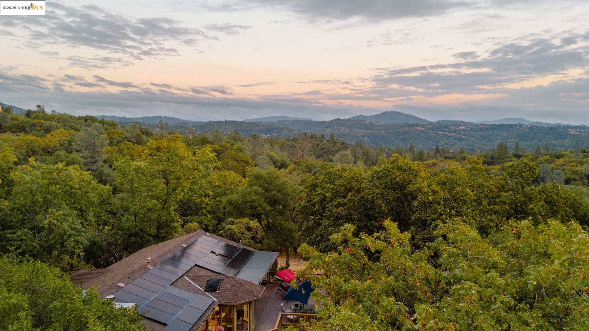 21950 Paseo De Los Portales Road Sonora, CA 95370 - Photo 46 of 47 an aerial view of a house with mountain view