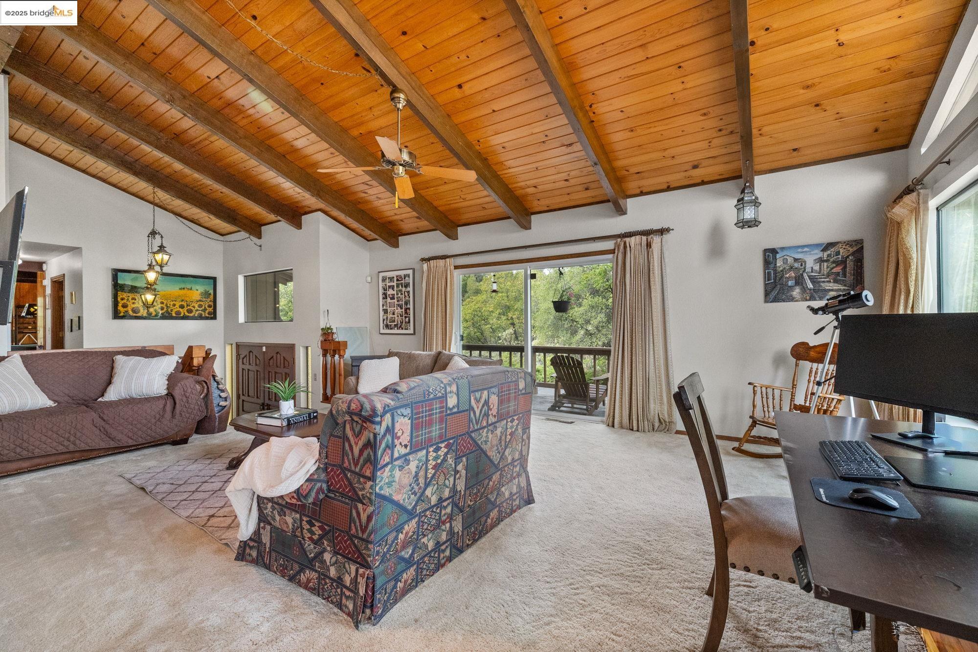 21950 Paseo De Los Portales Road Sonora, CA 95370 - Photo 6 of 47 a living room with furniture and a flat screen tv