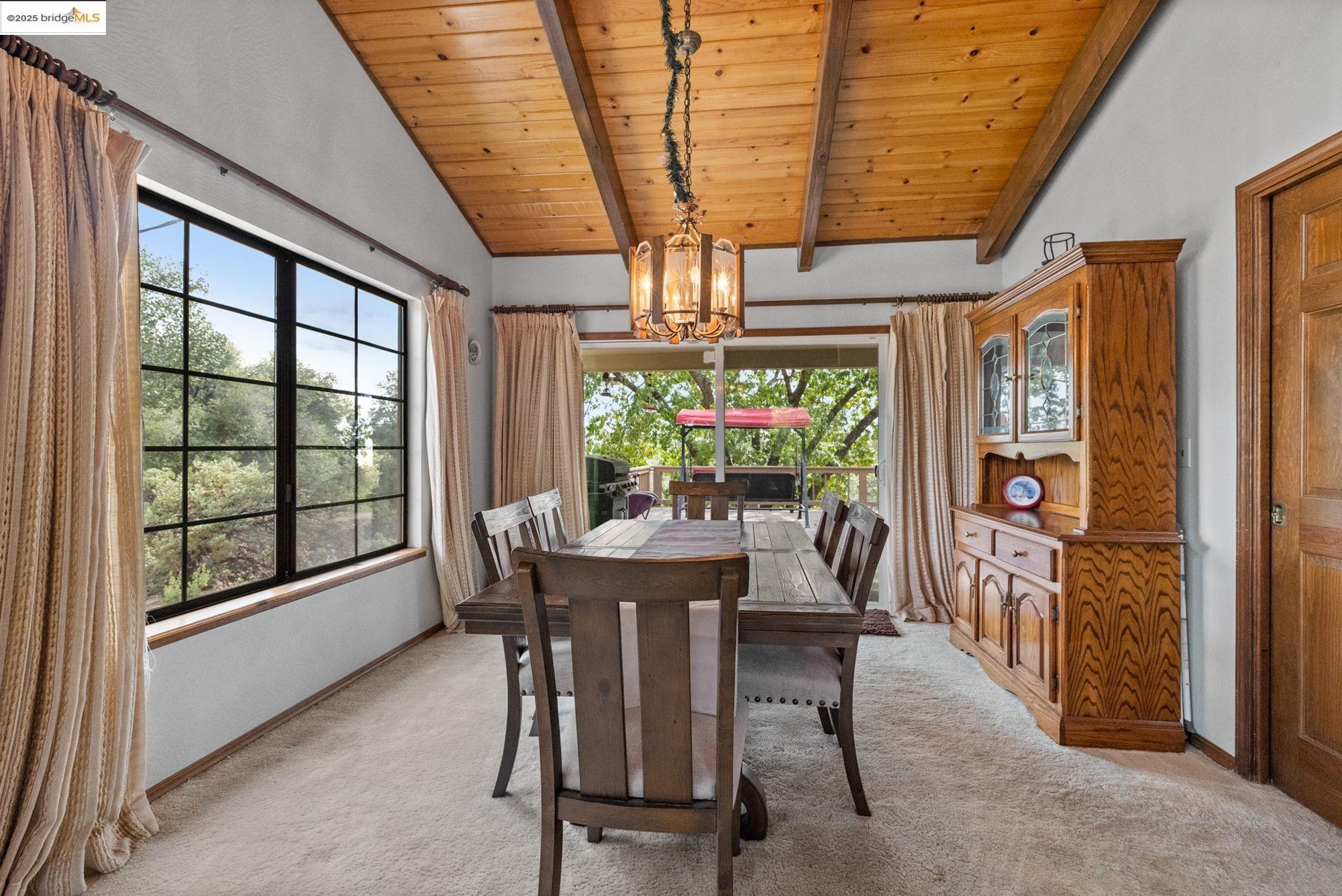 21950 Paseo De Los Portales Road Sonora, CA 95370 - Photo 9 of 47 a view of a dining room with furniture window and outside view