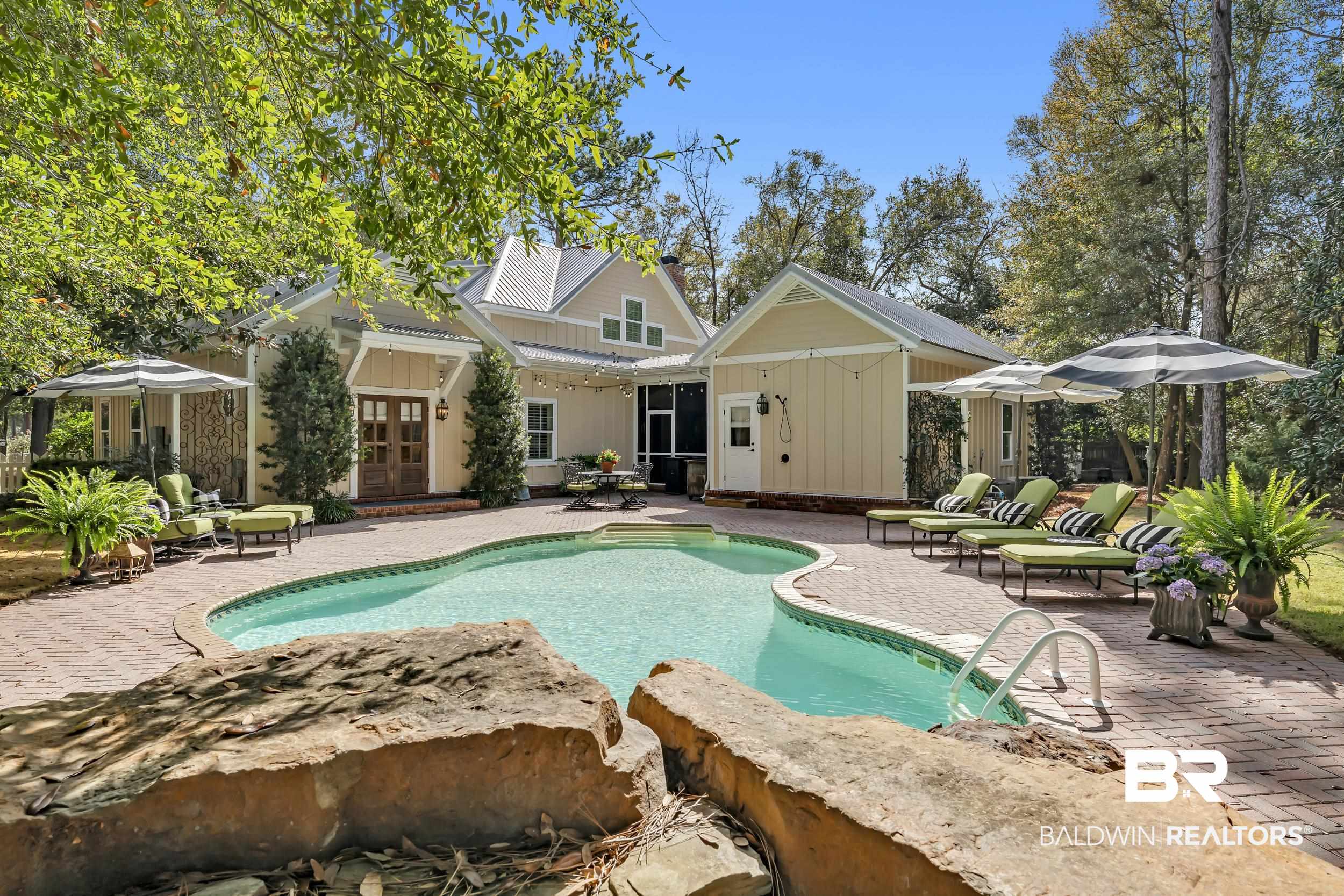 12161 Jessamine Street Magnolia Springs, AL 36555 - Photo 50 of 70 Swimming pool with a patio area, french doors, and an outdoor structure