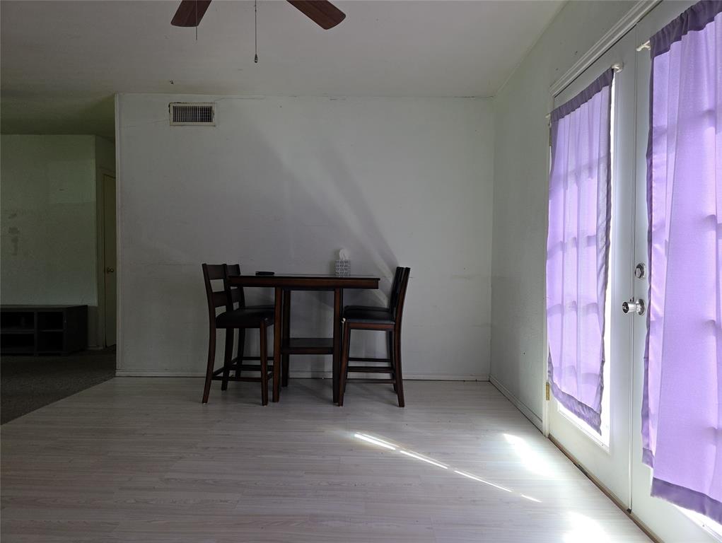2908 East 15th Street Plano, TX 75074 - Photo 2 of 6 a view of a room with furniture and a window