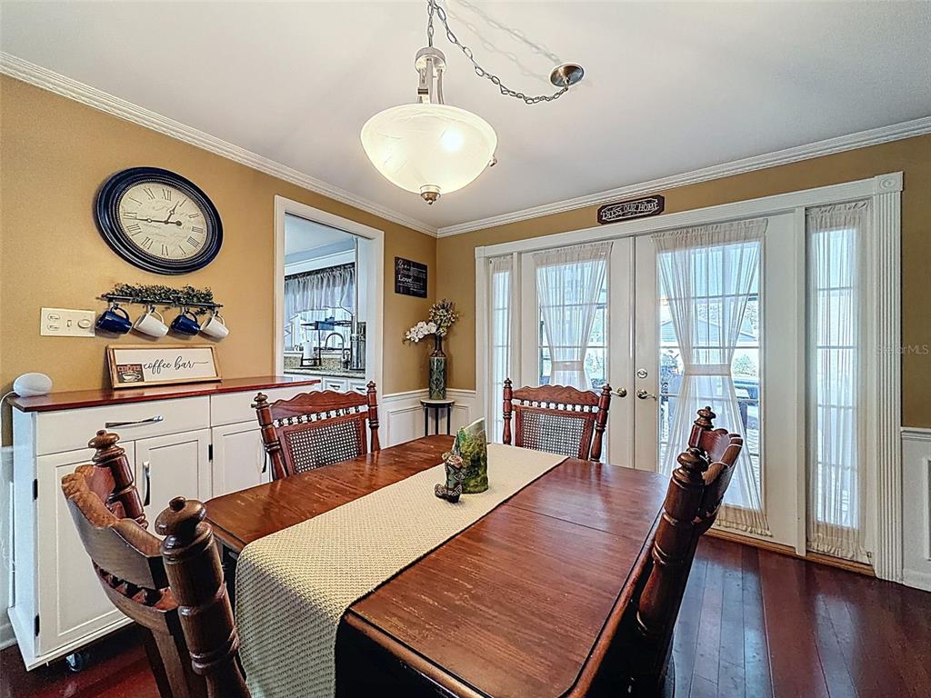 1602 Alder Way Brandon, FL 33510 - Photo 14 of 64 a view of a dining room with furniture window and wooden floor