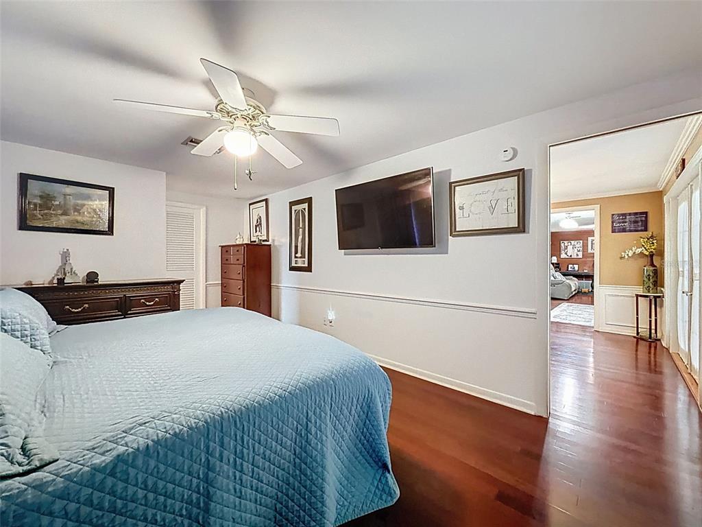1602 Alder Way Brandon, FL 33510 - Photo 17 of 64 a bedroom with a bed and a flat screen tv