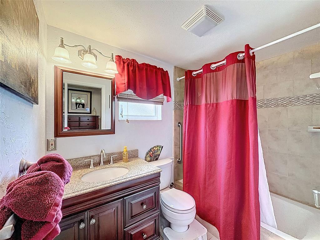 1602 Alder Way Brandon, FL 33510 - Photo 20 of 64 a bathroom with a granite countertop sink and a mirror