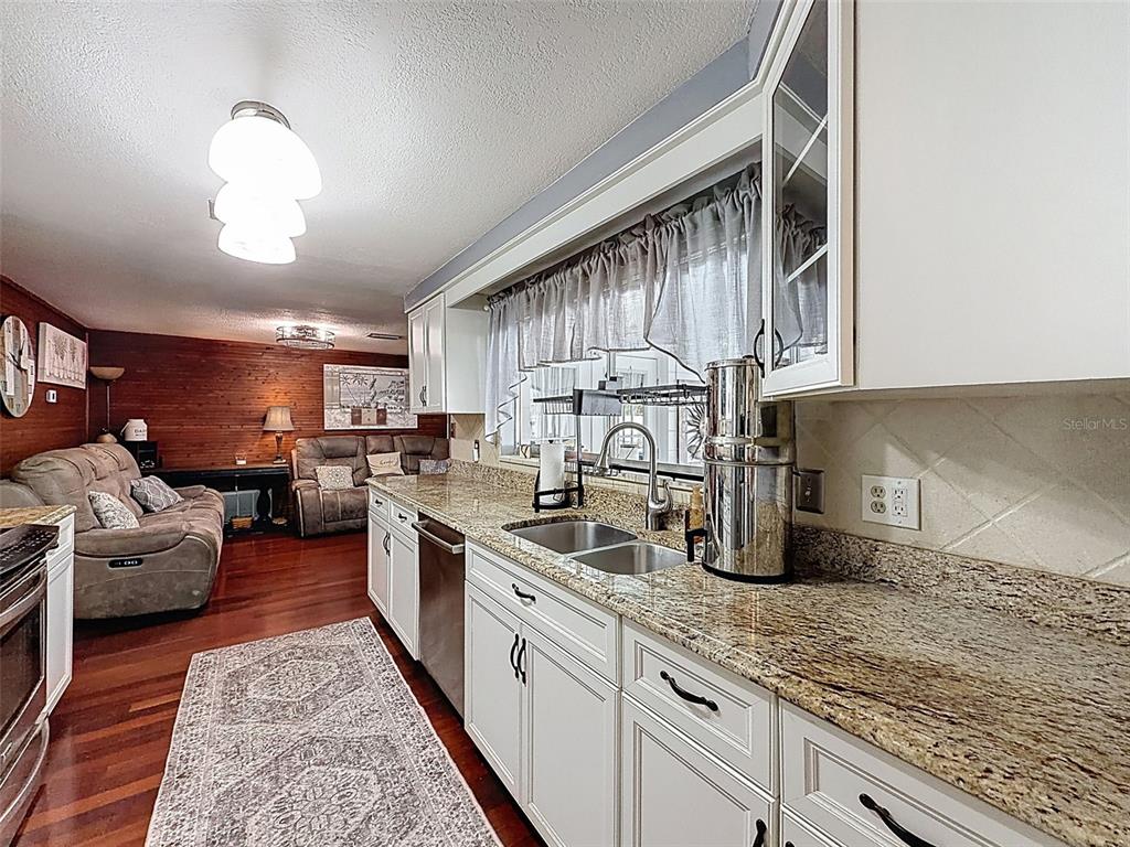 1602 Alder Way Brandon, FL 33510 - Photo 23 of 64 a kitchen with counter top space cabinets and stainless steel appliances