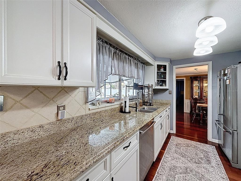 1602 Alder Way Brandon, FL 33510 - Photo 24 of 64 a large kitchen with a stove and a sink