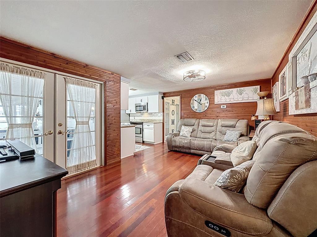 1602 Alder Way Brandon, FL 33510 - Photo 29 of 64 a living room with furniture and wooden floor