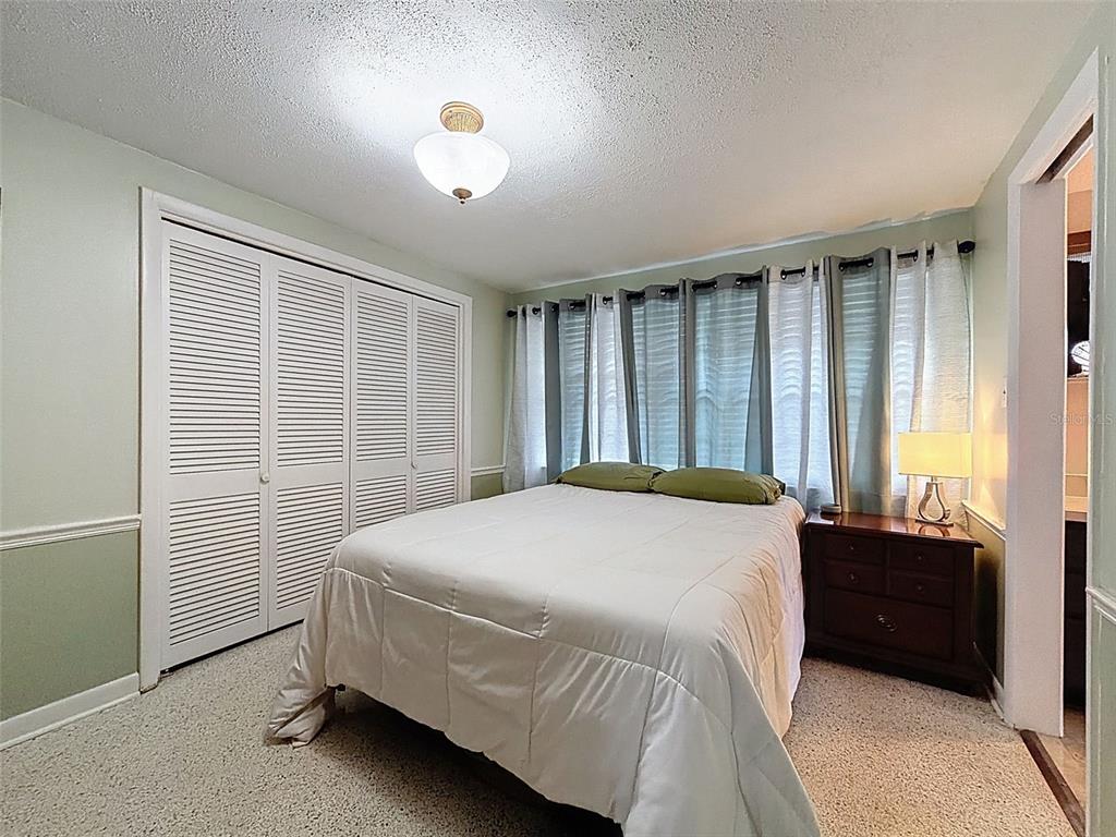 1602 Alder Way Brandon, FL 33510 - Photo 30 of 64 a bedroom with a bed and a window